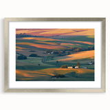 Textured art depicting abstract hills of Palouse in muted earth tones, silver-framed with mat, suitable for bedroom decor.