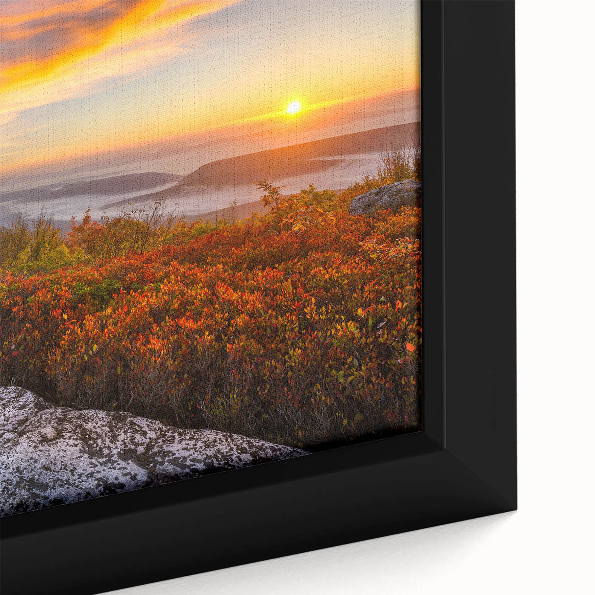 Close-up of textured black wall art featuring a colorful West Virginia scenery on a framed canvas.