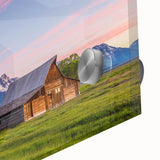 Mid-century modernist style depiction of the Grand Tetons in muted earth tones on a large acrylic glass print.