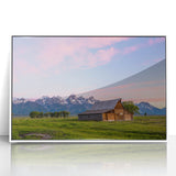 Acrylic print of Grand Tetons landscape in muted earth tones, framed in white, suitable for modern nursery decor.