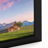 Extra large framed canvas of the Grand Tetons with a textured black foreground and colorful sky, ideal for living room decor.