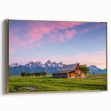 Framed canvas featuring a vintage-style landscape painting of the Grand Tetons in muted earth tones.