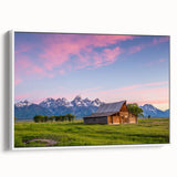 Vintage poster art of the Grand Tetons on a framed canvas, featuring a colorful palette, ideal for living room decor.