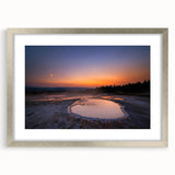 Textured art depicting an abstract representation of Yellowstone in muted earth tones on a framed silver mat.