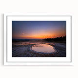 Abstract art print of Yellowstone scenery in muted earth tones on a framed white mat, ideal for dining room decor.