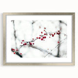 Textured abstract art print depicting a winter scene in muted blue and white tones, framed in silver.