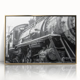 Mid-century modernist art print of various vehicles in muted colors, framed in gold acrylic.