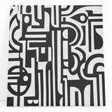 Abstract geometric stretched canvas artwork showcasing vibrant blue, yellow, and red shapes, leaning against a modern interior wall, perfect for contemporary decor.