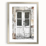 Textured art depicting a rustic Italian door, in muted earth tones on a silver-framed mat, suitable for bedroom decor.