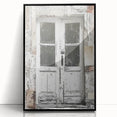 Large abstract wall art print depicting a rustic Italian door, in muted earth tones, framed in black acrylic.
