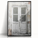 Large abstract wall art print depicting a rustic Italian door, in muted earth tones, framed in black acrylic.