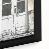 Close-up of a rustic Italian door depicted in textured black wall art on a framed canvas, ideal for living room decor.