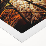 Art deco poster of geometric buildings in muted gold and black on rolled canvas, suitable for dining room wall art.