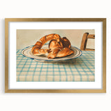 Extra large abstract art print of pastries in a gold frame, featuring textured details and muted colors.