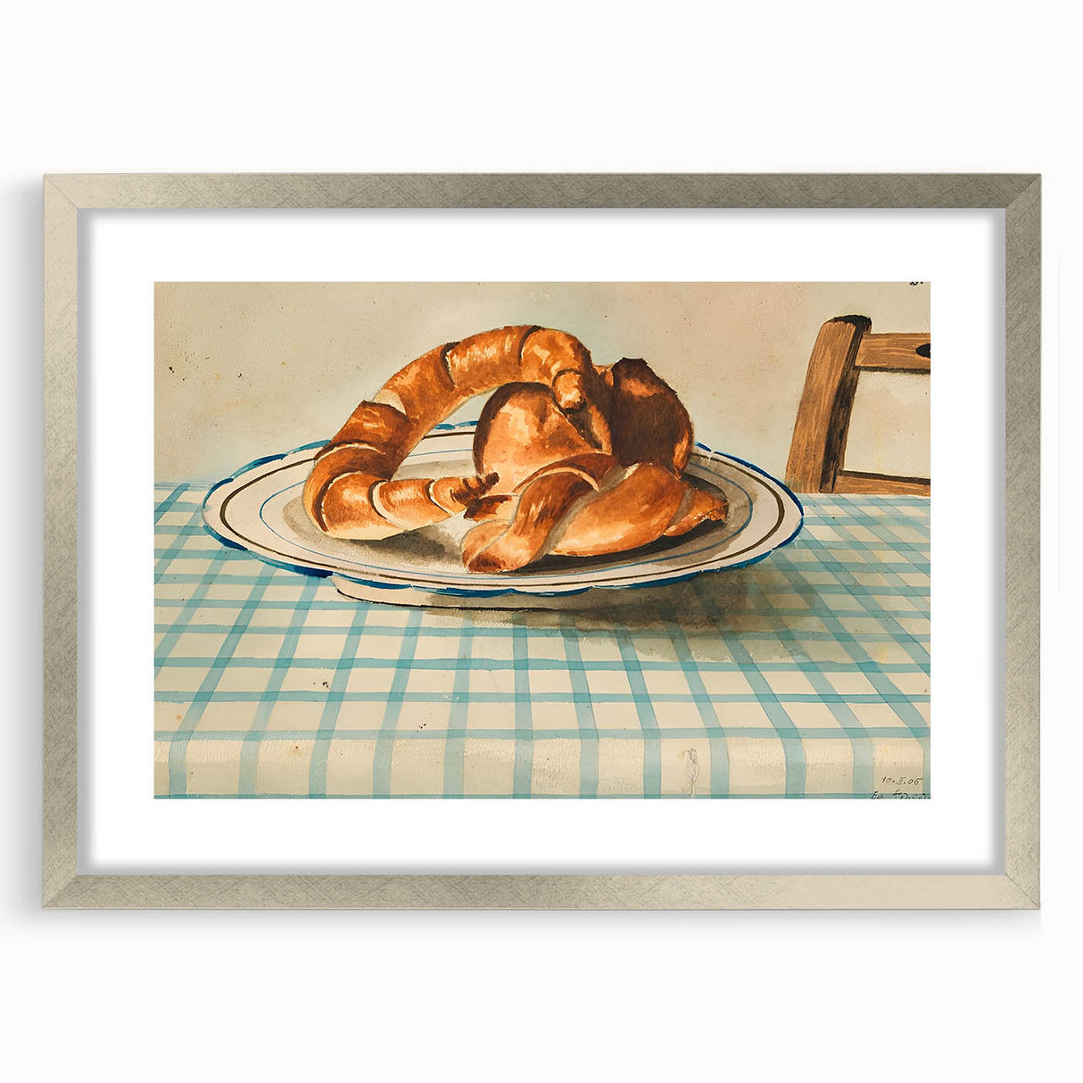 Textured art print of abstract pastries in muted brown and cream tones, framed in silver.