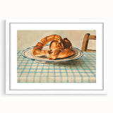 Abstract art print of assorted pastries in soft pastel tones on a white framed mat, ideal for dining room decor.