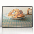 Large abstract wall art featuring assorted pastries in muted colors, presented in a black framed acrylic.