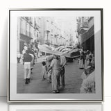 Mid-century modernist art depicting a group of people dining, in silver framed acrylic, suitable for nursery wall decor.