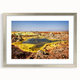 Abstract art print of Ethiopian scenery in muted earth tones, framed in silver, suitable for bedroom or dining room decor.