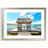 Abstract art print of a Mauritian landscape in cool blue and green tones on a silver-framed mat.