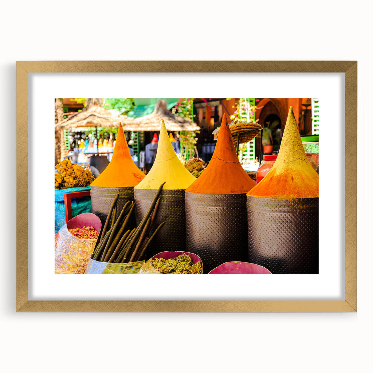 Textured abstract art print depicting a Moroccan landscape in earth tones, framed in gold, suitable for bedroom decor.