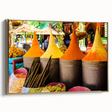 Framed canvas featuring a vintage-style Moroccan landscape with a palette of gold and black.