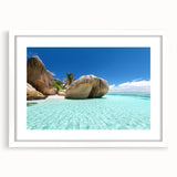 Textured art of an abstract Seychelles landscape in muted earth tones, framed with a white mat, ideal for bedroom art.