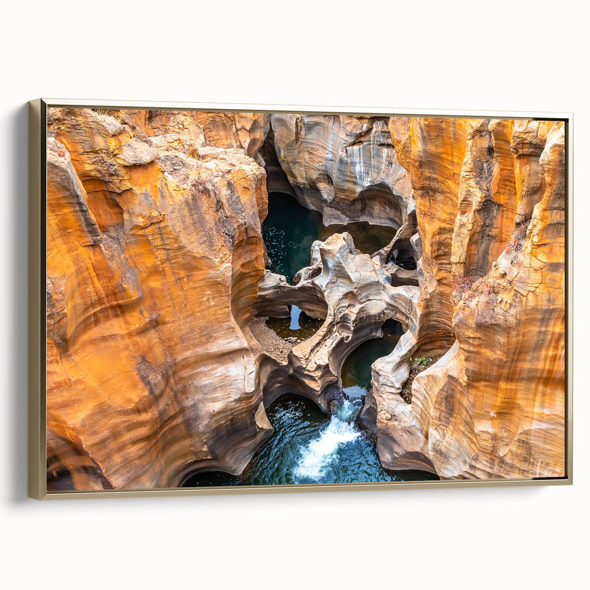 Framed canvas featuring a vintage-style landscape painting of the South African scenery in muted gold and black tones.