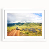 Abstract art print of a Tanzanian landscape in muted earth tones on a framed white mat, ideal for dining room decor.