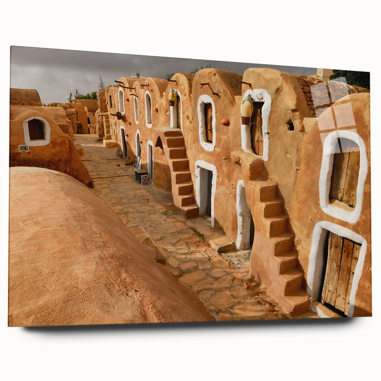 Large abstract wall art of Tunisian scenery in vibrant earth tones on acrylic glass.