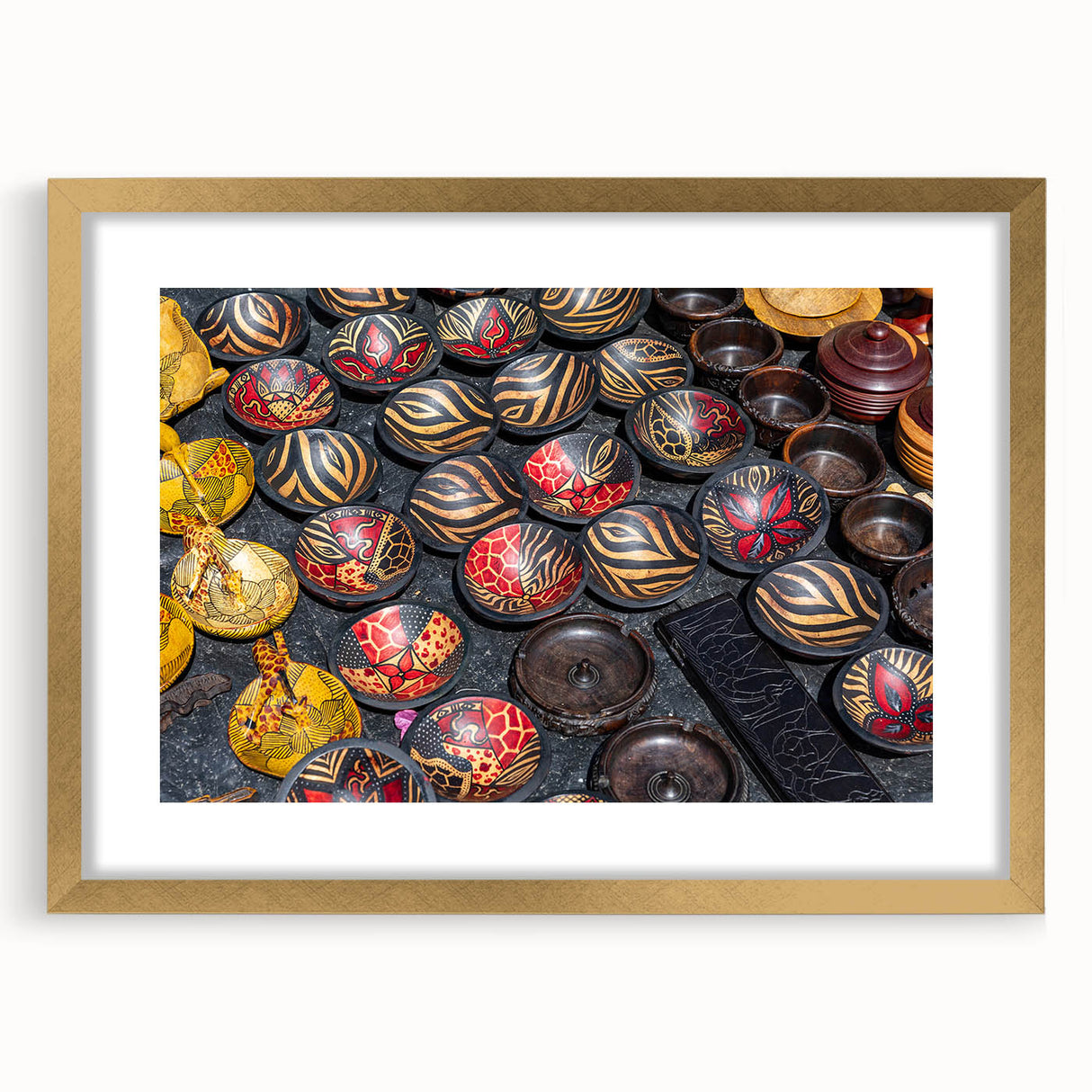 Extra large abstract art print depicting a textured African landscape in earth tones, framed in gold.