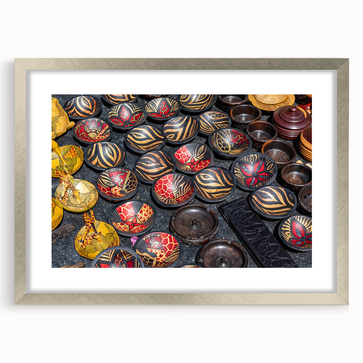 Textured abstract art print depicting African scenery in earth tones, framed in silver, ideal for bedroom art.