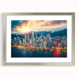 Textured art depicting an abstract Hong Kong skyline in muted gray and silver hues, framed with a silver mat.