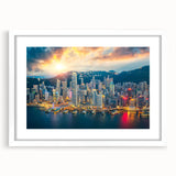 Abstract art print of Hong Kong skyline in muted gray and blue tones, framed with a white mat.