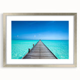Textured abstract art print of the Maldives in muted blue and white tones on a framed canvas, suitable for bedroom decor.