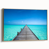 Framed canvas featuring a serene Maldivian landscape in muted blue and green tones, ideal for bedroom wall art.