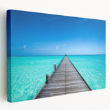 Side view of a stretched canvas depicting the serene Maldives scenery in soft blue and white tones.