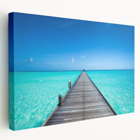 Side view of a stretched canvas depicting the serene Maldives scenery in soft blue and white tones.