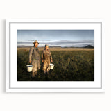 Abstract art print of a Mongolian landscape in muted earth tones on a framed white mat, ideal for dining room decor.