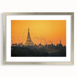 Textured art of a Myanmar landscape in muted earth tones on a framed silver mat, suitable for bedroom decor.