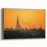 Framed canvas featuring a vintage-style landscape painting of a Myanmar scenery in muted gold and black tones.