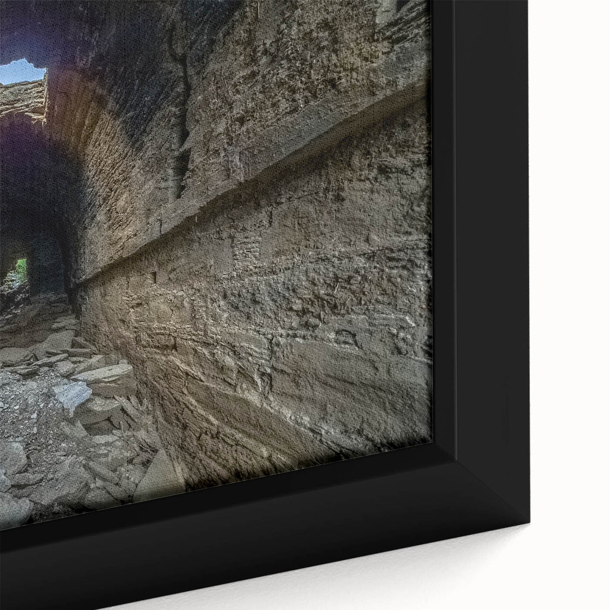 Framed canvas featuring a textured, colorful abstract design with black elements.