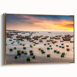 Framed canvas featuring a vintage-style landscape painting of a Vietnamese scenery in muted gold and black tones.