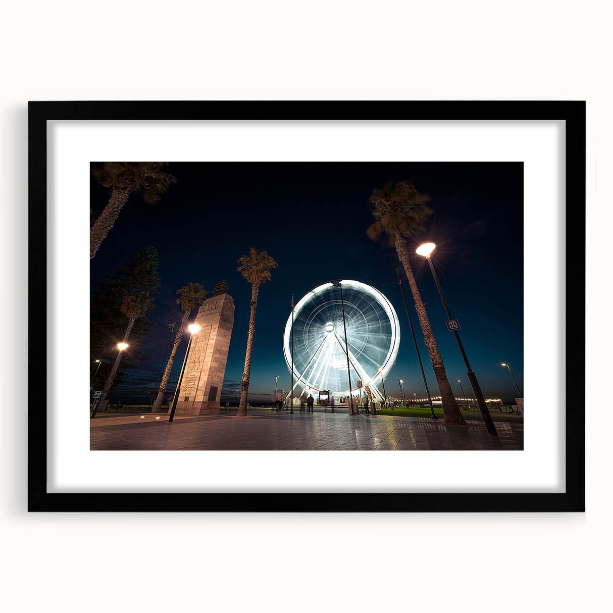 Abstract art print of colorful, textured scenery, framed in black, ideal for living room decor.