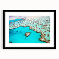 Extra large, textured abstract art print of the Great Barrier Reef in vibrant, colorful hues on a black framed canvas.