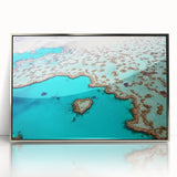 Acrylic print of the Great Barrier Reef in vibrant blue and green tones, framed in silver.