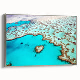 Vintage poster art of the Great Barrier Reef on a framed canvas, featuring vibrant ocean hues, ideal for living room decor.