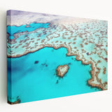 Side view of a stretched canvas featuring the Great Barrier Reef in vivid blue and green tones.