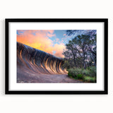 Abstract art print depicting a colorful, textured scenery of Perth, in a large black frame with mat.