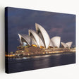 Side view of a large stretched canvas featuring a detailed Sydney skyline in muted blue and gray tones.